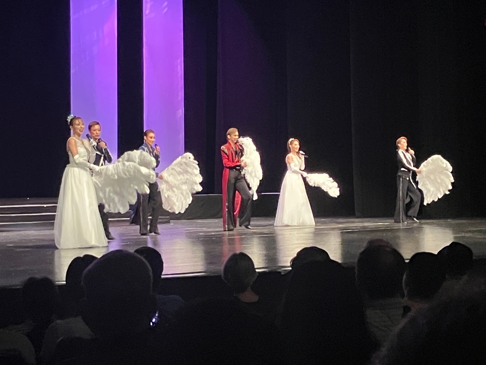 Photo of Takarazuka Revue alumni performing on stage at Miller Outdoor Theatre